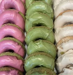 there are many doughnuts with different colors on them