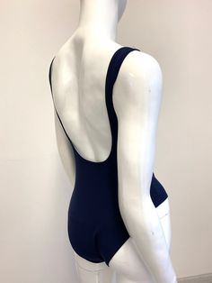 "FREE SHIPPING TO USA FOR ALL ORDERS OVER 35$! Choose right size by following our size chart below, thank you! We use FEDEX PRIORITY shipping service to the United States to guarantee the fastest delivery in 3-4 days. One piece swimsuit in dark blue fabric. Round neckline, shoulder straps, open back, high cut and lining at crotch. Stretchy and body fitting material. COLOR: DARK BLUE MEASUREMENTS: X-Small - Bust - 31\" - 32\" / 80 - 80 cm - Hips - 32\" - 34\" / 82 - 86 cm - Waist - 22\" - 23,5\"/ Navy Swimwear For Swimming, Fitted Navy Swimwear For Swimming, Navy Fitted Swimwear For Swimming, Fitted Blue One Piece For Poolside, Blue Fitted One-piece For Poolside, Seamless Backless Blue Swimwear, Blue Seamless Backless Swimwear, Fitted V-back Swimwear For Poolside, Blue Swimwear With Moderate Back Coverage And Stretch