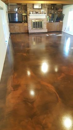 an empty living room with shiny metallic floors