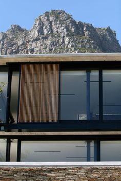 a house with mountains in the background