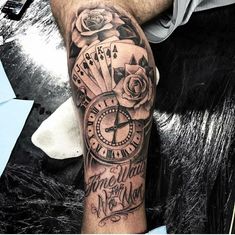 a man's arm with a clock and roses on it