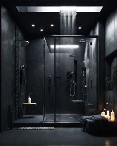 a modern bathroom with black walls and flooring