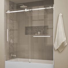 a bathroom with a glass shower door and towel rack on the wall next to it