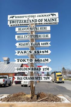 a pole with many different signs on it