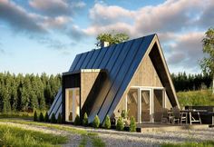 a small house with a metal roof in the middle of a field