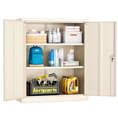 an open cabinet with many items on the shelves and in front of it is a blue backpack