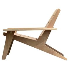 a wooden chair that is made out of plywood and has one leg extended to the side