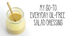 a jar filled with liquid next to a wooden spoon and the words, my go - to everyday oil - free salad dressing