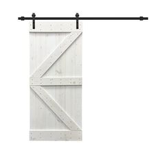 an open white barn door with black metal hardware on the top and bottom bars in front of it