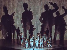 a group of people standing on top of a stage