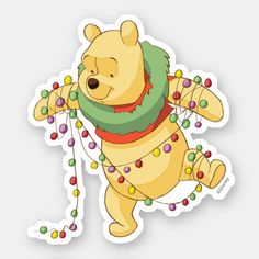 a winnie the pooh sticker with christmas lights around it's neck and legs