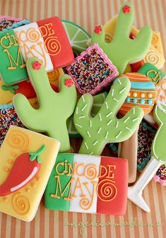 some decorated cookies are sitting on a table