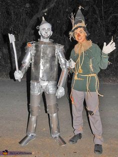 two people dressed in costumes standing next to each other