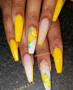 yellow and white nails with flowers on them