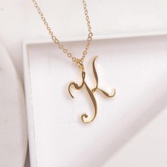 K Initial Necklace - Cursive "K" initial gold pendant necklace - Monogram necklace for women - Personalized gold Initial necklace for her Dainty "K" initial. Perfect every day necklace. Lovely gift for your self, sister, bridesmaids, new mom. Pendant: Base metal is brass and 14K gold plated. Chain is 18 inches, 14k gold filled.  Note: model shots might show a different initial, only to illustrate overall look and length of the chain. This listing is for the "K" initial. Luxury Initial Pendant Jewelry With Name Detail, Luxury Gold Initial Pendant Name Necklace, Cheap Initial Pendant Necklaces With Letter Print, Luxury Initial Pendant Necklace, Luxury Initials Pendant Jewelry, Cheap Initial Pendant Jewelry With Chain, Luxury Initials Name Necklace For Personalized Gift, Luxury Elegant Initial Pendant Custom Necklace, Luxury Initial Pendant Necklace For Formal Occasions