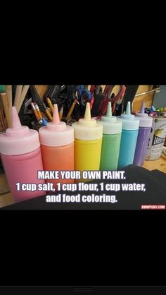 there are many different colored paint bottles on the table, and one is labeled make your own paint