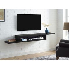 a flat screen tv mounted to the side of a wall