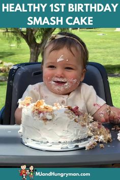 a baby sitting in a highchair eating cake with the words healthy 1st birthday smash cake