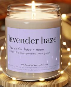 lavender haze / nourishing love glow candle in glass jar on wooden coaster