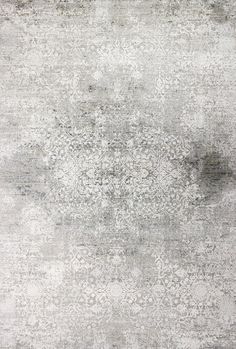 an area rug with grey and white colors