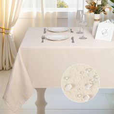 the table is set with silverware and place settings for an elegant dinner or celebration