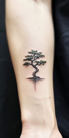 a small tree tattoo on the wrist