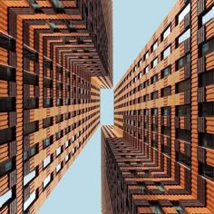 an upward view of some tall buildings