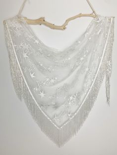 "Shawl pictured with white glass beaded trim! We love the vibe and drama of these handmade pieces! The bridal shawls are a super chic accessory for brides any time of year! The unique, romantic design will add drama to your photos and make for a stunning accessory that all your guests will be talking about! A high-fashion handmade Arrow and Thread stole is a gorgeous addition to your wedding look and we've got you covered! Literally! The handmade shawl wraps are made with high quality fabrics an White Bridal Accessories For Festive Celebrations, Bridal Shawls, Star Shawl, Boho Celestial, Velvet Fringe, Bridesmaid Shawl, Bridal Shrug, Boho Shawl, Celestial Wedding