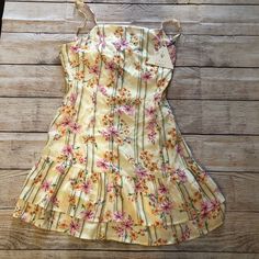 Bloom Baby Mini Dress New With Tags Yellow Floral Print Flower Dress Casual Short, Cute Yellow Dress For Garden Party, Lined Yellow Mini Dress, Yellow Lined Mini Dress, Cute Yellow Sundress For Garden Party, Cute Yellow Sundress For A Garden Party, Yellow Casual Sundress With Ruffles, Casual Yellow Ruffled Sundress, Casual Yellow Sundress With Ruffles