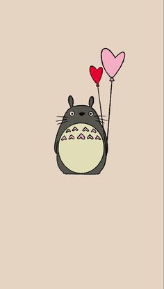 a totoro holding two heart shaped balloons