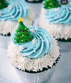 cupcakes decorated with frosting and christmas tree decorations