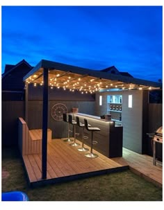 an outdoor bar with lights on the roof and barstools in the back yard