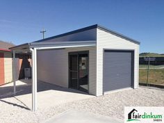 two garages side by side with one door open