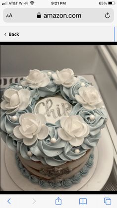 the cake is decorated with blue and white flowers