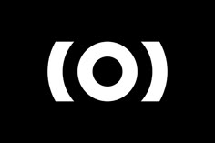 a black and white photo with the letter o in it's center, on a dark background