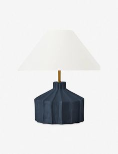 a blue table lamp with a white shade