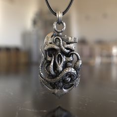 Dive deep into the mysteries of the sea with our Skull & Octopus Anchor 925 Sterling Silver Necklace. This piece is a fusion of nautical charm and gothic allure, capturing the essence of the deep blue and its legends. Expertly crafted from premium 925 sterling silver, the necklace features a detailed pendant combining a skull, octopus, and anchor, symbolizing adventure, depth, and the unknown. Its intricate design ensures it stands out, making it a conversation starter wherever you go. Whether y Silver Necklaces Women, Gothic Necklace, Mens Silver Necklace, Pet Necklace, Gifts For Brother, Gothic Jewelry, Minimalist Necklace, Dainty Necklace, Everyday Jewelry