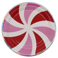 a pink and white paper plate with a candy cane design on the front, against a white background