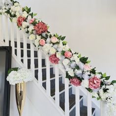 the flowers are lined up on the stairs