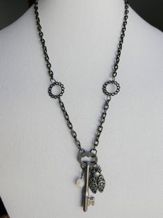 Antique skeleton key on a gunmetal-plated aluminum chain with steampunk-style metal bug charm and quartz drop. Chain measures at 25 inches and has a lobster clasp in the back. Chain can be shortened or lengthened upon request--please contact me before ordering. Designer Wishlist, Skeleton Key Necklace, Back Chain, Style Steampunk, Steampunk Style, Skeleton Key, Key Necklace, Steampunk Fashion, Pendant Necklaces