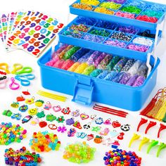 an assortment of colorful beads and toys on a white surface