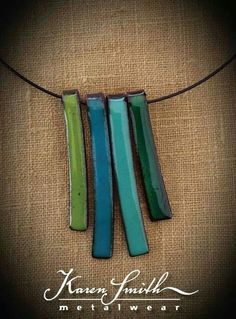 the necklace is made with green and blue beads