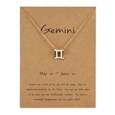 a zodiac sign necklace on a card with an inscription in the middle that reads, gemin