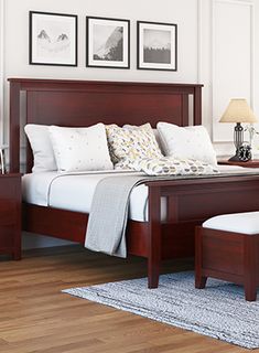 a bedroom scene with focus on the bed and foot board, along with two nightstands