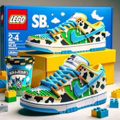 a pair of shoes with legos in front of it and the box behind them