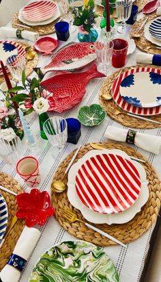 the table is set with red, white and blue plates