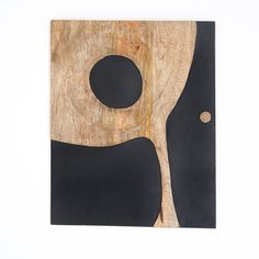 a wooden cutting board with black circles on it