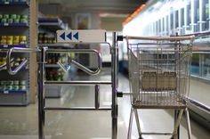 an empty shopping cart in a grocery store