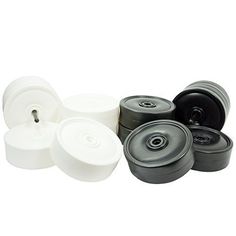 an assortment of white and black plastic wheels