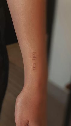 a person's foot with the word love written on it in small cursive font